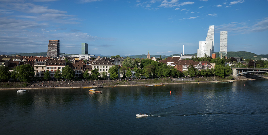 This photograph shows a boat navigated on the Rhine River with towers (right) in the background hosting the headquarters of Swiss pharmaceutical giant Roche, in Basel on Saturday (AFP photo)