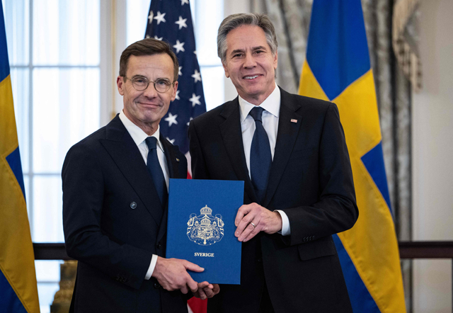 AFP photo  US Secretary of State Antony Blinken receives the NATO ratification documents from Swedish Prime Minister Ulf Kristersson during a ceremony at the US State Department, as Sweden formally joins the North Atlantic alliance, in Washington, DC, on Thursday