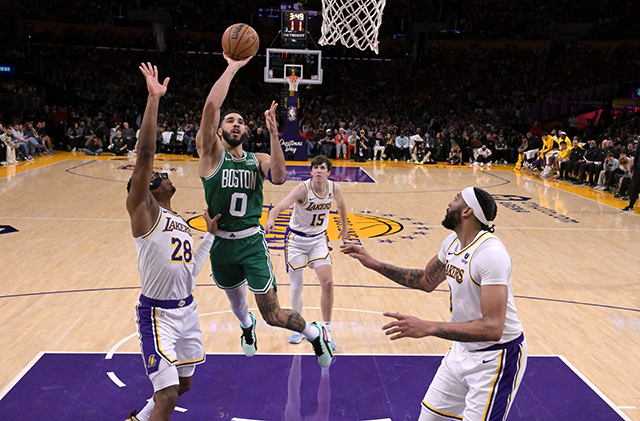 Jayson Tatum #0 of the Boston Celtics drives to the basket against Rui Hachimura #28 and Anthony Davis #3 of the Los Angeles Lakers in the second half at Crypto.com Arena on Tuesday in Los Angeles, California (AFP photo)