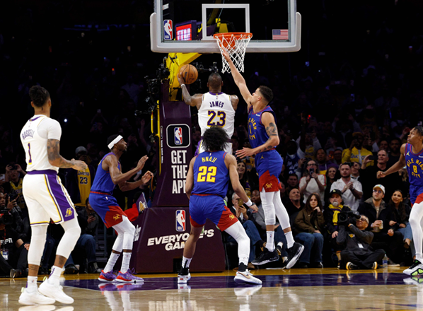 LeBron James #23 of the Los Angeles Lakers scores his 40,000th career point during the first half against Michael Porter Jr. #1 of the Denver Nuggets at Crypto.com Arena on Sunday in Los Angeles, California (AFP photo)