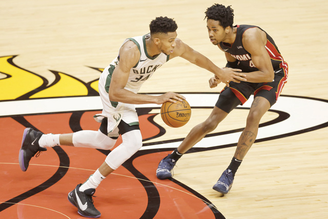 Giannis Antetokounmpo #34 of the Milwaukee Bucks drives against KZ Okpala #4 of the Miami Heat during the second quarter at American Airlines Arena on Tuesday in Miami, Florida (AFP photo)