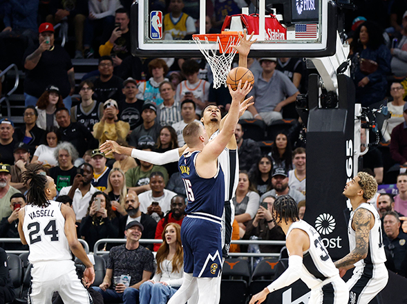 Victor Wembanyama #1 of the San Antonio Spurs blocks the shot of Nikola Jokic #15 of the Denver Nuggets in the first half at Moody Centre on Friday in Austin, Texas (AFP photo)