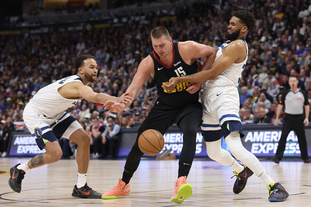 Nikola Jokic #15 pf the Denver Nuggets is fouled driving against Kyle Anderson #1 and Karl-Anthony Towns #32 of the Minnesota Timberwolves in the second quarter during Game Two of the Western Conference Second Round Play-offs at Ball Arena on Monday in Denver, Colorado (AFP photo)