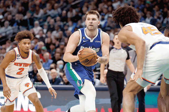 Luka Doncic #77 of the Dallas Mavericks passes the ball against the New York Knicks in the second half at American Airlines Center on Wednesday in Dallas, Texas (AFP photo)