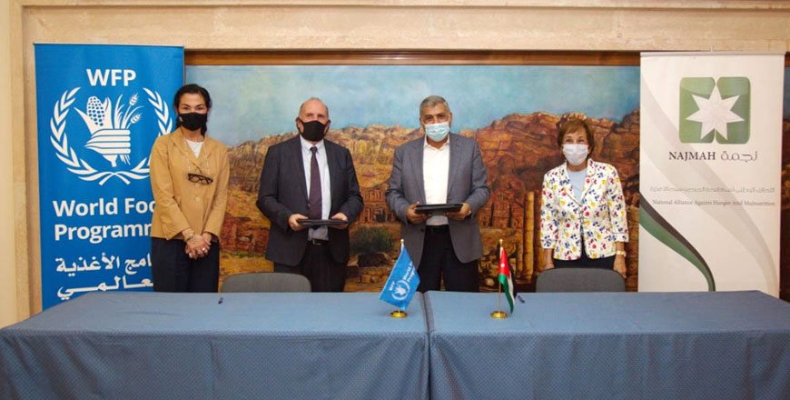 HRH Princess Basma poses for a group photo during the signing ceremony of an agreement between the National Alliance Against Hunger and Malnutrition (NAJMAH) and the United Nations World Food Programme to implement a training programme focusing on building the capacity of 1,500 participants on Tuesday (Petra photo)