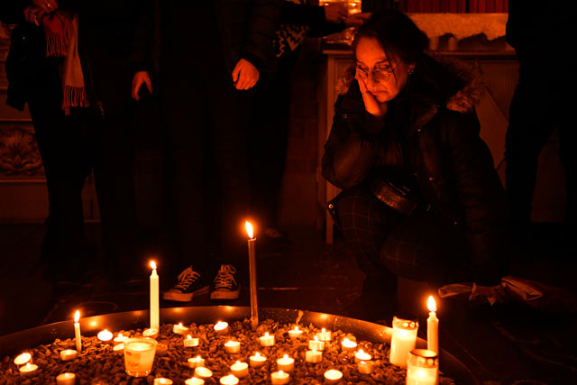 A mourner gathers at a memorial service for the victims of Ukrainian Airlines flight PS752 crash in Iran at Storkyrkan church in Stockholm on January 15 (AFP photo)