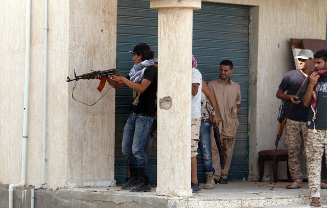 Forces loyal to Libya’s UN-backed unity government clash with militants in the city of Sirte, 450km east of Tripoli, on Sunday (AFP photo)