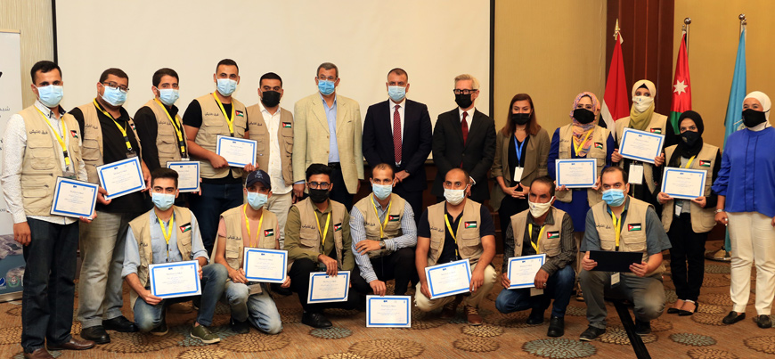 Interior Minister Mazen Faraiah poses for a group photo during the launch of a volunteer team to combat the coronavirus pandemic in Jordan on Saturday (Petra photo)