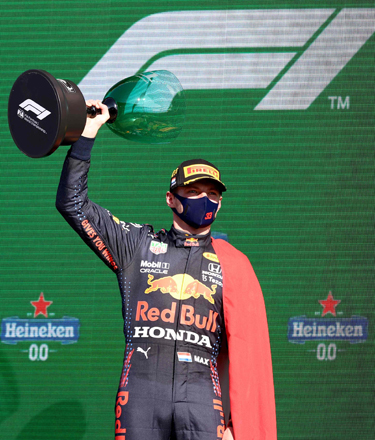 Red Bull’s Dutch driver Max Verstappen holds the winner’s trophy on the podium of the Zandvoort circuit after The Netherlands’ Formula One Grand Prix in Zandvoort on Sunday (AFP photo by Kenzo Tribouillard)