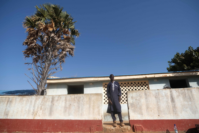 Abdul Ganjari, an 18-year-old who escaped from gunmen who kidnapped hundreds of students from Government Science Secondary school, looks on in Kankara, in northwestern Katsina State, Nigeria, on Wednesday (AFP photo)