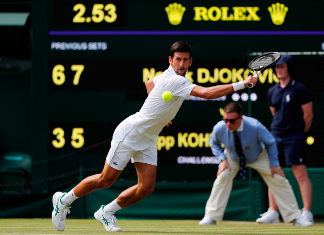 Serbia’s Novak Djokovic returns the ball to Germany’s Philipp Kohlschreiber during their men’s singles first round match on the first day of the 2019 Wimbledon Championships at The All England Lawn Tennis Club in Wimbledon, southwest London, on Monday (AFP photo)