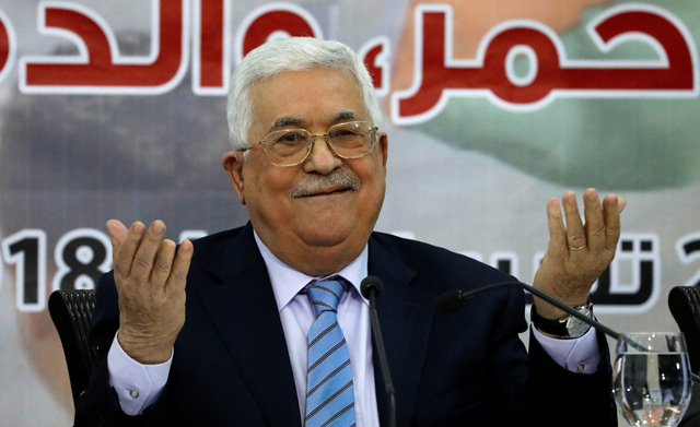 Palestinian President Mahmoud Abbas gestures during the meeting of the Central Council of the Palestinian Liberation Organisation in Ramallah, in the occupied West Bank, on Sunday  (Reuters photo)
