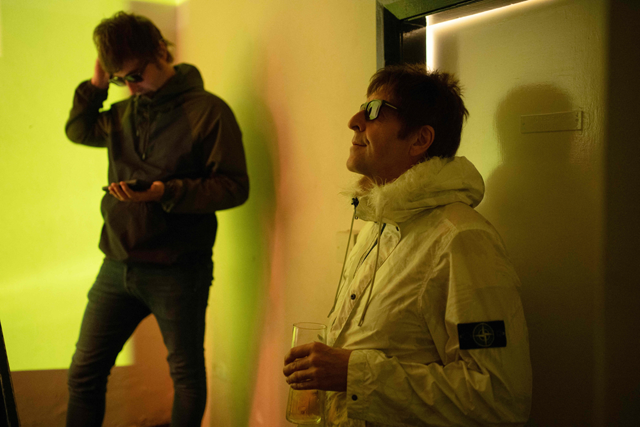 Ian Alcock (right), performing as Liam Gallagher, and Paul Mitchell, performing as Noel Gallagher in the Oasis tribute band 'Definitely Mightbe', wait backstage before playing at Swarcliffe Working Mens Club in Leeds, England, on Friday (AFP photo)