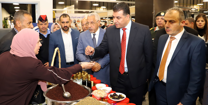 Agriculture Minister Khalid Hneifat visits a stall during the inauguration of 22nd National Olive Festival and the Rural Products Exhibition at Mecca Mall on Thursday (Petra photo)