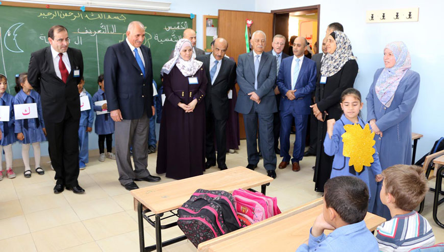 Deputy Prime Minister and Education Minister Mohammad Thneibat and Royal Court Secretary General Yousef Issawi visit a classroom at the newly opened Salbud Coeducational Elementary School in Sahab, Amman, on Thursday (Petra photo)