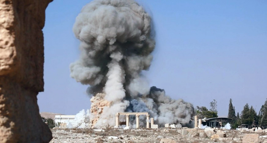 This undated file photo released Tuesday on a social media site used by Daesh militants, which has been verified and is consistent with other AP reporting, shows smoke from the detonation of the 2,000-year-old temple of Baal Shamin in Syria's ancient caravan city of Palmyra (AP photo)