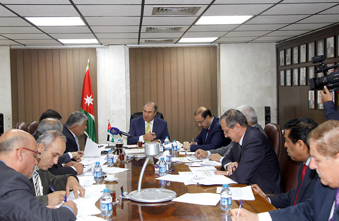 Prime Minister Hani Mulki chairs a meeting at the Finance Ministry to discuss economic performance in the first half of the current year in Amman on Tuesday (Petra photo)