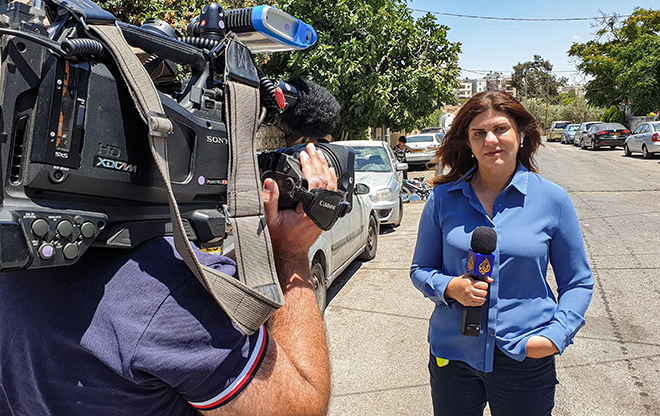 This handout file photo obtained from a former colleague of Al Jazeera's late veteran TV journalist Shireen Abu Aqleh, shows her reporting for the Qatar-based news channel from Jerusalem on May 22, 2021 (AFP photo)