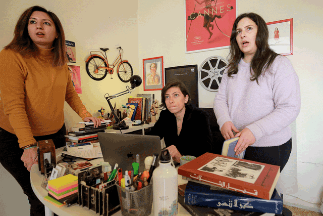 Darin J. Sallam (centre), Jordanian film writer and director, and Deema Azar (right) and Ayah Jardaneh, two of the producers of ‘Farha’, her debut narrative feature film as a director, speak with a fourth person during an interview at her office in Jordan’s capital Amman, on January 10 (AFP photo)