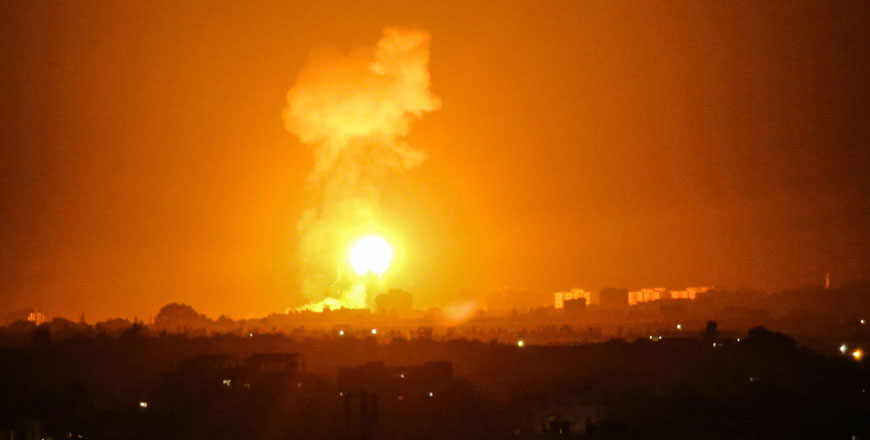Smoke and flames rise after Israeli war planes carried out air strikes over Khan Younis, Gaza Strip, on Sunday (AFP photo)