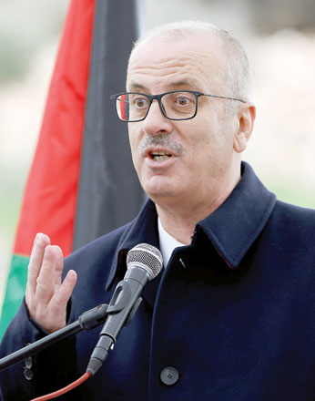 Palestinian Prime Minister Rami Hamdallah gestures as he speaks during the opening ceremony of a health centre near Hebron, in the Israel-occupied West Bank, on Monday (Reuters photo)