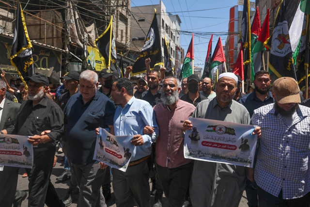 Supporters of the Palestinian Islamic Jihad group march in Gaza, on Friday (AFP photo)