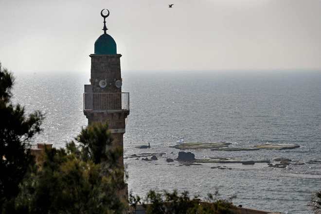 The minaret of a mosque overlooks the Mediterranean Sea in Jaffa, the historic Arab neighbourhood in southern Tel Aviv, on April 30  (AFP photo)