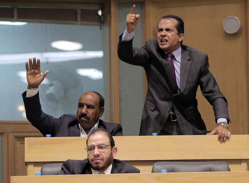 Lawmakers are seen during a House meeting on Tuesday, during which a state of chaos stirred by a protest over higher education policies led to a prompt end of the meeting (Photo by Osama Aqarbeh)
