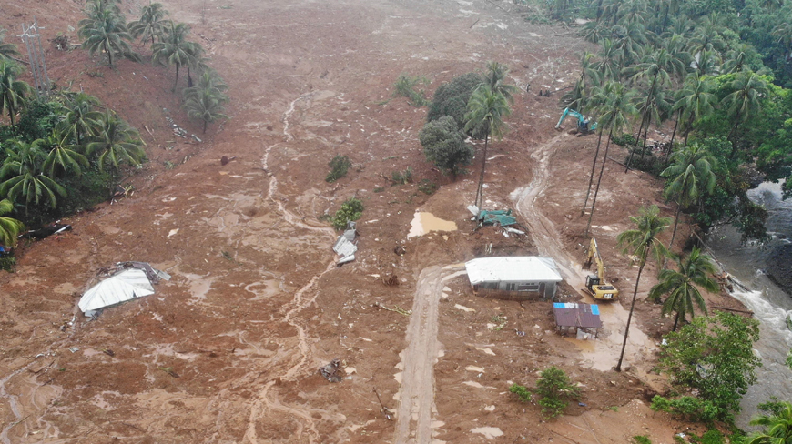 This aerial photo shows the collapsed mountain side and buried houses in the village of Bunga, Baybay town, Leyte province, in southern Philippines, on Tuesday  (AFP photo)