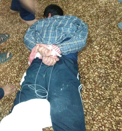 A photo purportedly showing the suspect in the killing of security officers early Monday when he was caught allegedly in a mosque basement outside Amman governorate. The photo was shared by Jordanians on social media networks 