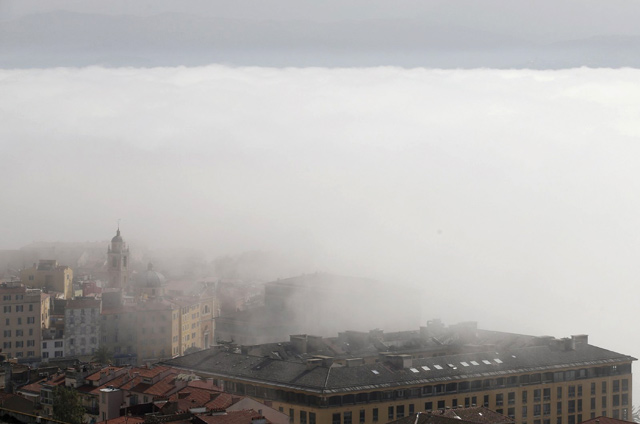 Smog and pollution over the capital Ajaccio on the French island of Corsica Smog and pollution settle  (AFP photo)