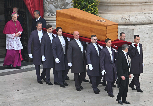 Pallbearers followed by German Archbishop Georg Gaenswein carry the coffin of Pope Emeritus Benedict XVI at the start of his funeral mass at St Peter's Square in the Vatican, on Thursday (AFP photo)