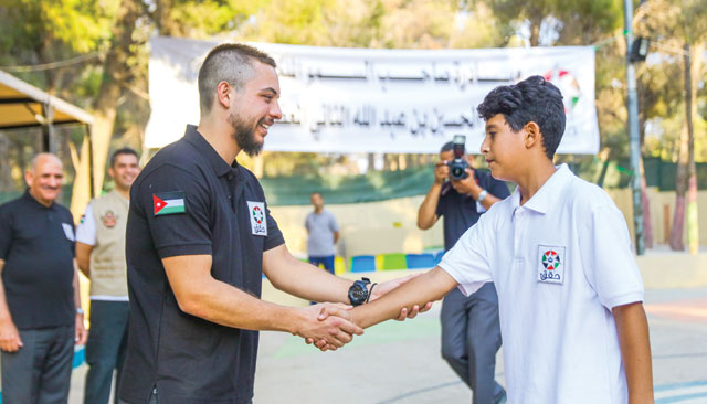 HRH Crown Prince Hussein shakes hands with a participant in a training camp set up under the Haqiq Initiative launched by the Crown Prince in Amman on Wednesday  (Photo courtesy of Royal Court)