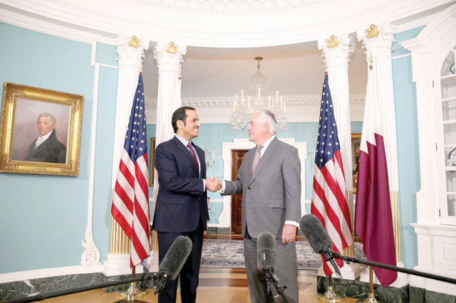 Foreign Affairs Minister of Qatar Mohammed Bin Abdulrahman Al Thani (left) and US Secretary of State Rex Tillerson shake their hands during their meeting at the State Department in Washington, United States, on Monday (Anadolu Agency photo)