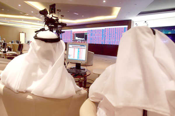 Traders monitor screens displaying stock information at Qatar Stock Exchange in Doha, Qatar, June 5, 2017 (Reuters file photo)
