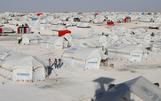 Children walk at a camp for displaced people who fled fighting in the Daesh stronghold of Raqqa, in Ain Issa, Syria, on Friday (Reuters file photo)
