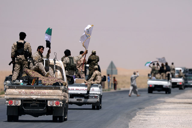 Syrian Democratic Forces fighters on their way to Raqqa, Syria, on Tuesday (Reuters photo)