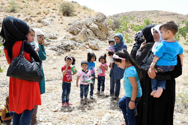 Syrian refugees seen at Lebanon’s border region of Arsal, Lebanon, on Wednesday (Reuters photo)
