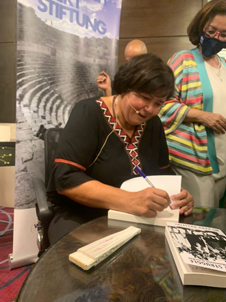 Rana Husseini signs her book at Crown Plaza Hotel Thursday night (Photo courtesy of Rana Husseini)