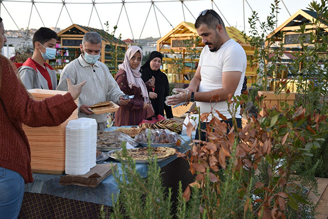 Visitors are seen at a stall at an olive festival organised by Rawabi Farah, a local NGO, in Dabouq, Amman (Photo courtesy of Rawabi Farah)