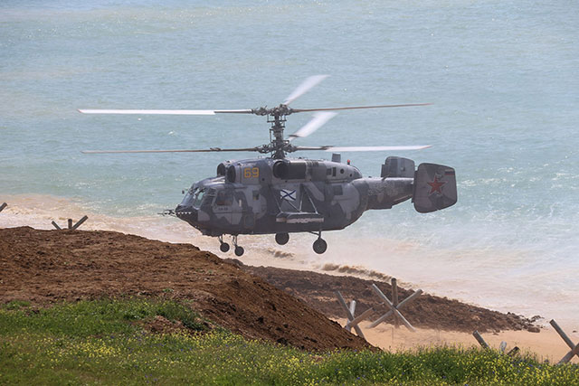 This handout picture released by the Russian Defence Ministry on Thursday shows a Russian military Kamov Ka-29 helicopter taking part in a military drill along the Opuk training ground not far from the town of Kerch, on the Kerch Peninsula in the east of the Crimea (AFP photo)