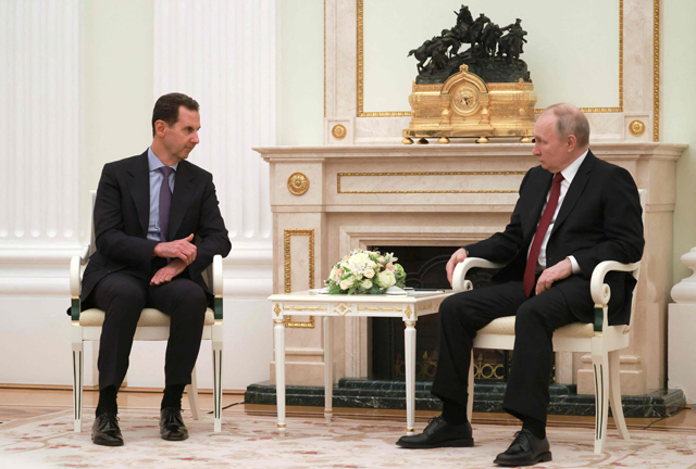Russian President Vladimir Putin meets with his Syrian counterpart Bashar Assad at the Kremlin in Moscow on Wednesday (AFP photo)