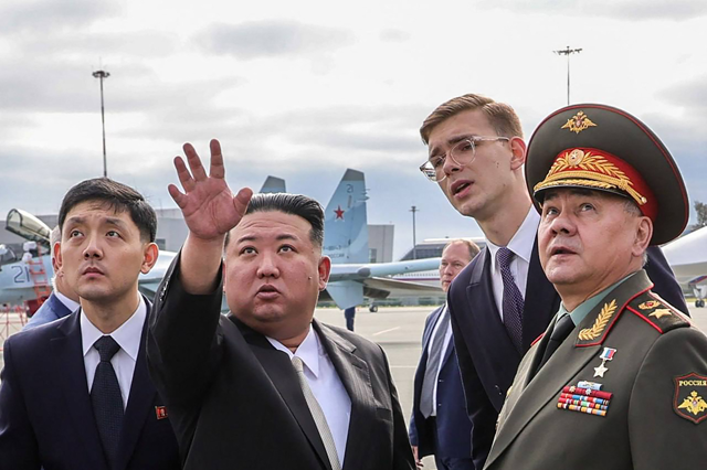 In this handout photo distributed by the Russian defence ministry, North Korea's leader Kim Jong-un and Russia's Defence Minister Sergei Shoigu visit Knevichi Aerodrome near Vladivostok, Primorsky region, on Saturday (AFP photo)