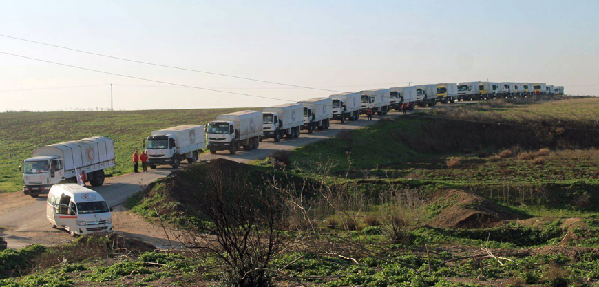 Aid trucks line a road before their departure for Damascus in this handout photo released on Wednesday (Reuters photo)
