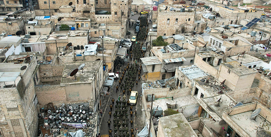 This aerial view shows graduates of Syria's General Security forces under the country's new administration marching during a ceremony in the northern city of Aleppo on February 12, 2025 (AFP photo)