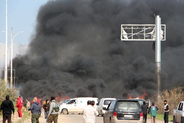 A picture taken on Saturday shows smoke billowing following a suicide car bombing in Rashidin, west of Aleppo, that targeted buses carrying Syrians evacuated from two besieged government-held towns of Fuaa and Kafraya (AFP photo)
