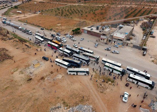 Buses carrying Syrian civilians and rebels, evacuated from Al Waer district of Homs, arrive to Jarabulus — which was liberated from the Daesh terror group as part of the operation Euphrates Shield, carried out by the Free Syrian Army with Turkish army support — in Syria, on Friday (Anadolu Agency photo)