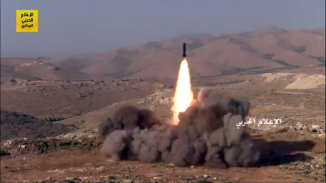 A picture released by the media office of Lebanon’s Shiite group Hizbollah on Saturday shows a surface-to-surface missile being fired towards extremist positions in Jurud Arsal, a mountainous region bordering Syria, during a military operation against militants in the area (AFP photo)