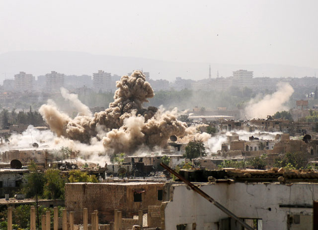 Smoke rises after air and ground strikes over the Cobar district of Eastern Ghouta in Damascus, Syria, on Friday (Anadolu Agency photo)