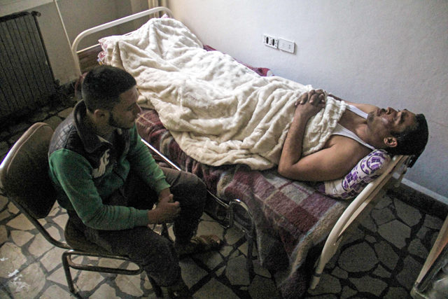 A picture taken on Thursday shows 40-year-old Hassan Youssef, a victim of Tuesday’s suspected toxic gas attack in Khan Sheikhun, receiving medical care in a hospital in the nearby northwestern Syrian city of Idlib (AFP photo)